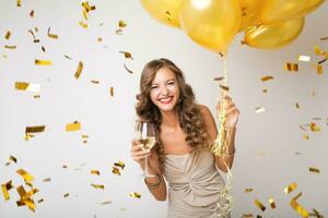 pretty woman celebrating party in golden confetti photo