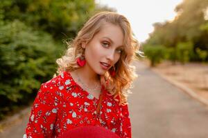 attractive stylish blond smiling woman in straw red blouse summer fashion photo
