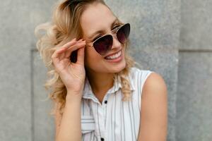 portrait of young attractive stylish woman smiling photo