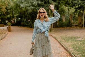 attractive woman walking in street photo