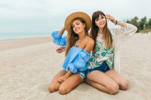 stylish beautiful women on summer vacation on tropical beach photo