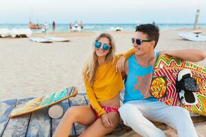 young couple having fun on beach photo