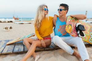 young couple having fun on beach photo