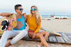 young couple having fun on beach photo