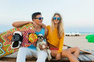 young couple having fun on beach photo