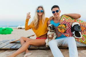 young couple having fun on beach photo