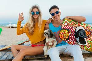 young couple having fun on beach photo