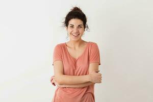 portrait of young natural looking smiling happy hipster pretty woman in pink shirt photo