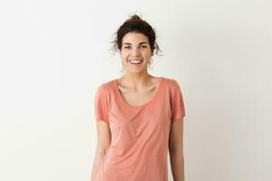 portrait of young natural looking smiling happy hipster pretty woman in pink shirt photo