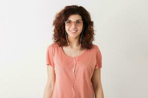 portrait of young natural looking smiling happy hipster pretty woman in pink shirt photo