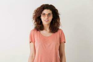 portrait of young natural looking smiling happy hipster pretty woman in pink shirt photo