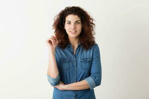 young pretty woman curly hair blue shirt, hipster style photo