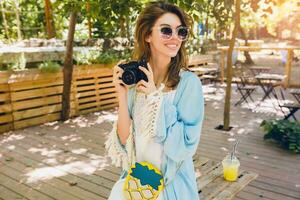 young attractive stylish woman in park photo