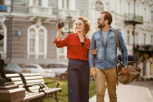 man and woman on romantic vacation walking together photo