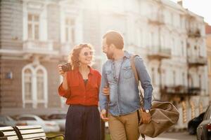 man and woman on romantic vacation walking together photo