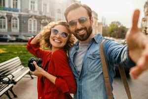 man and woman on romantic vacation walking together photo