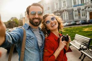 man and woman on romantic vacation walking together photo