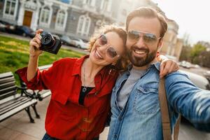 man and woman on romantic vacation walking together photo