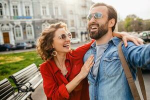 man and woman on romantic vacation walking together photo