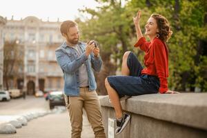 man and woman on romantic vacation walking together photo