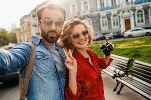 man and woman on romantic vacation walking together photo