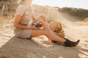 woman in desert walking on safari photo