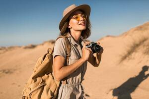 woman in desert walking on safari photo