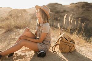 woman in desert walking on safari photo