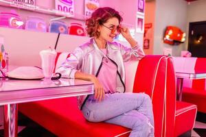 stylish smiling woman in retro vintage cafe photo