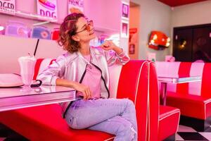 stylish smiling woman in retro vintage cafe photo