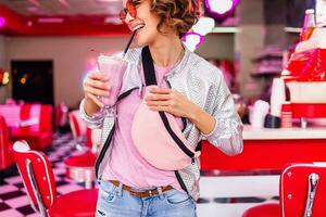 stylish smiling woman in retro vintage cafe photo