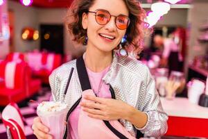 stylish smiling woman in retro vintage cafe photo