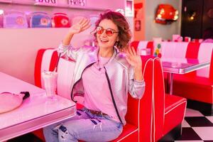 stylish smiling woman in retro vintage cafe photo