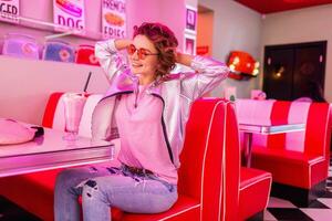 stylish smiling woman in retro vintage cafe photo