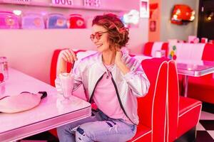 stylish smiling woman in retro vintage cafe photo