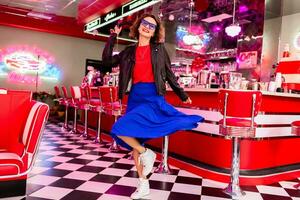 stylish smiling woman in retro vintage cafe photo