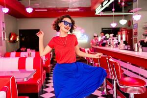 stylish smiling woman in retro vintage cafe photo