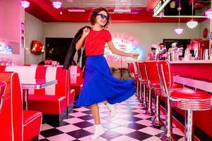 stylish smiling woman in retro vintage cafe photo