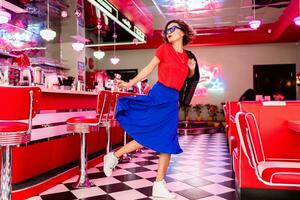 stylish smiling woman in retro vintage cafe photo