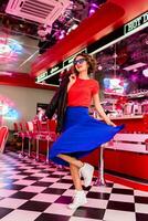 stylish smiling woman in retro vintage cafe photo