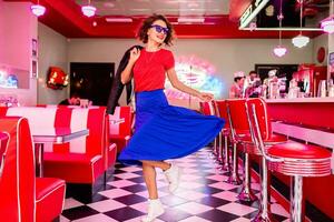 stylish smiling woman in retro vintage cafe photo