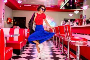 stylish smiling woman in retro vintage cafe photo