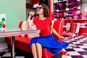 stylish smiling woman in retro vintage cafe photo