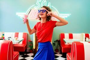 stylish smiling woman in retro vintage cafe photo