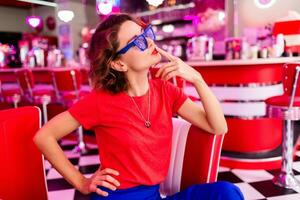 stylish smiling woman in retro vintage cafe photo