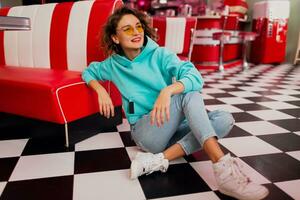 stylish smiling woman in retro vintage cafe photo