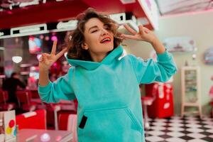 stylish smiling woman in retro vintage cafe photo