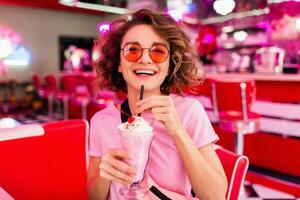 stylish smiling woman in retro vintage cafe photo