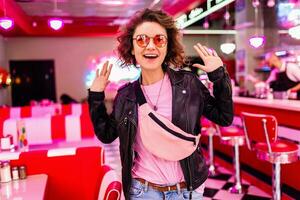 stylish smiling woman in retro vintage cafe photo