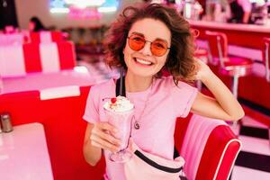 stylish smiling woman in retro vintage cafe photo